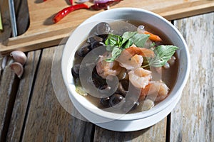 Basa mushroom soup with herbs and boiled shrimp. photo