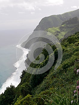 Basalt cliff of Faja do Araujo seen from the miradouro da Ponta do Sossego on the island of Sao Miguel photo