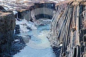 Basalt column formation in a canyon in winter