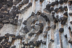 Basalt columnar units and swallow nests. Garni gorge, Armenia