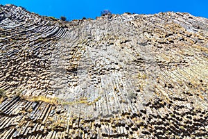 Basalt columns Symphony of Stones near the shore of the river Azat near the village Garni, Armenia. Tourism landmark in Armenia