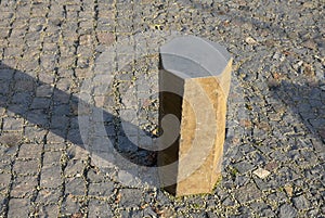 Basalt hexagonal natural column created by the gradual solidification of lava, is used in the city as a safety dividing bollard on photo