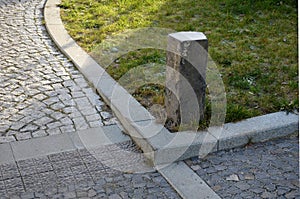 Basalt hexagonal natural column created by the gradual solidification of lava, is used in the city as a safety dividing bollard on photo
