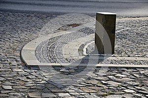 Basalt hexagonal natural column created by the gradual solidification of lava, is used in the city as a safety dividing bollard on photo