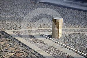 Basalt hexagonal natural column created by the gradual solidification of lava, is used in the city as a safety dividing bollard on photo