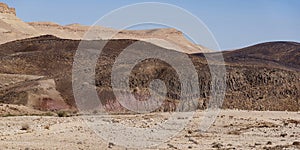 Basalt Hill with Prisms and Colorful Soils in the Makhtesh Ramon Crater in Israel