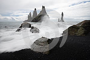 Basalt rock formations Troll toes on black beach. Reynisdrangar, Vik, Iceland