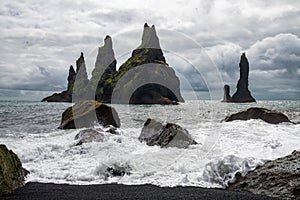 Basalt rock formations Troll toes on black beach. Reynisdrangar, Vik, Iceland