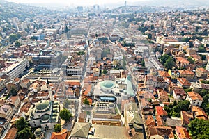 Bascarsija old bazaar streets with Gazi Husrev-beg Mosque and downtown in the background, aerial view, Sarajevo, Bosnia and