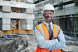 We base our success on your satisfaction. Portrait of a confident young man working at a construction site.