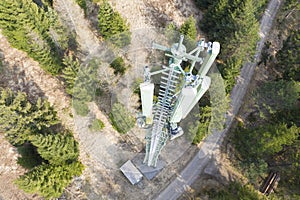 Base radio cell station mast pole in forest