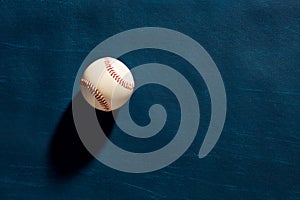 Baseball ball on dark moody blue background