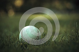 Baseball ball on the green grass