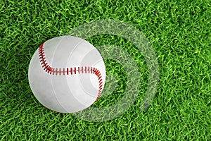 Baseball ball on green grass