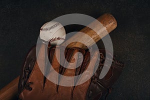 Baseball ball, wooden bat and vintage glove