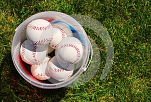 Baseball. Balls in the Basket on Green Grass