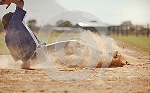 Baseball, baseball player running and diving for home plate in dirt during sport ball game competition on sand of