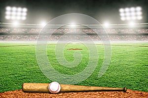 Baseball Bat and Ball on Field in Outdoor Stadium With Copy Space