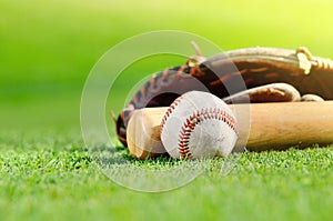 Baseball bat, ball and glove
