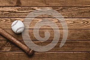 Baseball bat and ball on wooden floor.  Sport theme background with copy space for text and advertisment