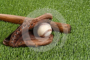 Baseball bat with glove and ball