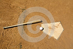 Baseball and Bat on Home Plate