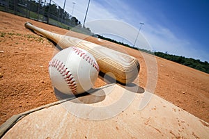 Baseball and Bat on Home Plate