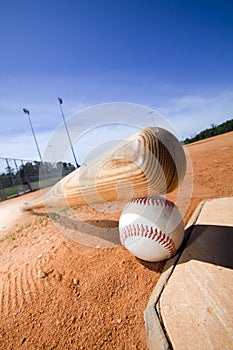 Baseball and Bat on Home Plate