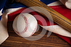 Baseball, bat on a wooden background