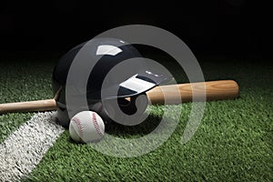 Baseball batting helmet bat and ball on field with stripe