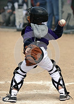 Baseball catcher throwing ball