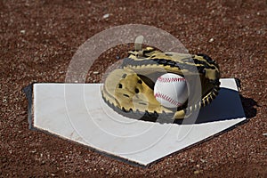 Baseball Catchers Mitt With Ball On Homeplate