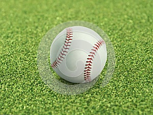 Baseball on the clear green grass turf close-up