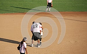 Baseball coach helping a player