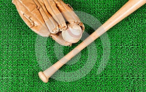 Baseball equipment on artificial green grass turf field