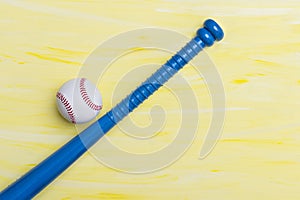 Baseball equipment on yeallow background. Online workout concept