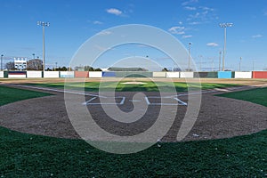 Baseball field with artificial turf on sunny day