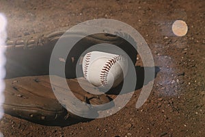 Baseball field with ball and glove closeup for sport game