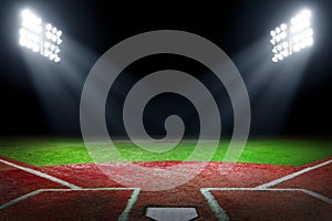 Baseball field at night with bright floodlights photo