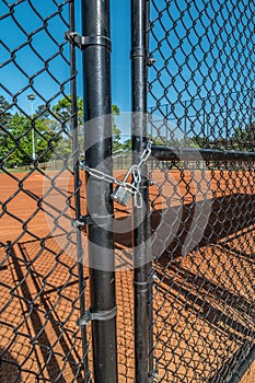 Baseball field padlocked Coronavirus closeup