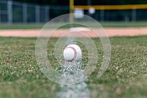Baseball on foul line background photo