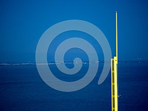 A baseball foul pole overlooking a body of water