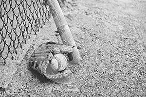 Baseball glove with ball on field