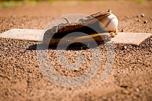 Baseball Glove and Ball on Pitcher's Mound