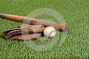 Baseball with glove and bat