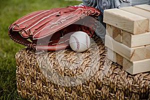 Baseball in a Glove in the Outfield. Baseball Mitt Glove with Ball. Wood blocks stack game with copyspace.