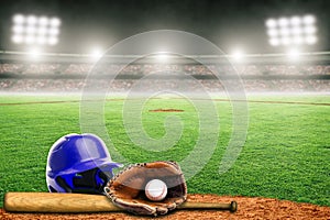 Baseball Helmet, Bat, Glove and Ball on Field in Outdoor Stadium With Copy Space