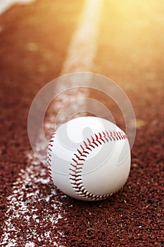 Baseball on the infield chalk line photo