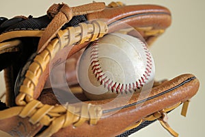 Baseball in leather glove - little league, sports