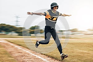 Baseball, man and running celebration on baseball field after scoring homerun. Exercise, fitness and winning baseball photo